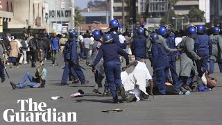 Zimbabwe riot police use teargas and batons to clear protesters [upl. by Anial17]